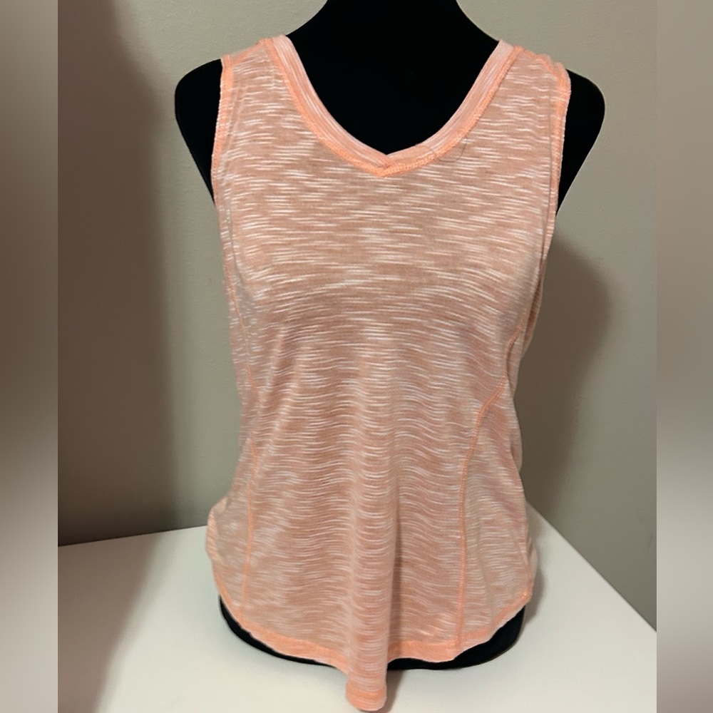 A neon pink sports shirt, it’s see through.